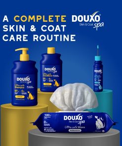 DOUXO Skin & Coat Care products including DOUXO Oatmeal shampoo, and DOUXO Oatmeal conditioner, multipurpose wipes, and dewaxing ear cleaner on a blue background.