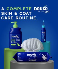DOUXO Skin & Coat Care products including DOUXO puppy shampoo, DOUXO multipurpose wipes, and DOUXO dewaxing ear cleaner on a blue background.